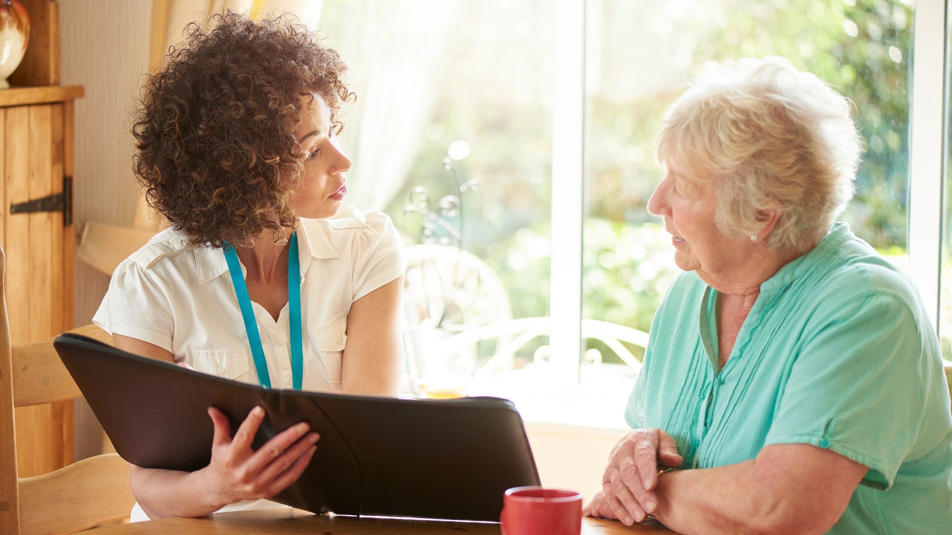 Woman planning funeral service with client